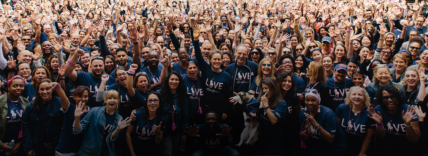 Ralph Lauren employees in navy Pink Pony tees at Pink Pony Walk.